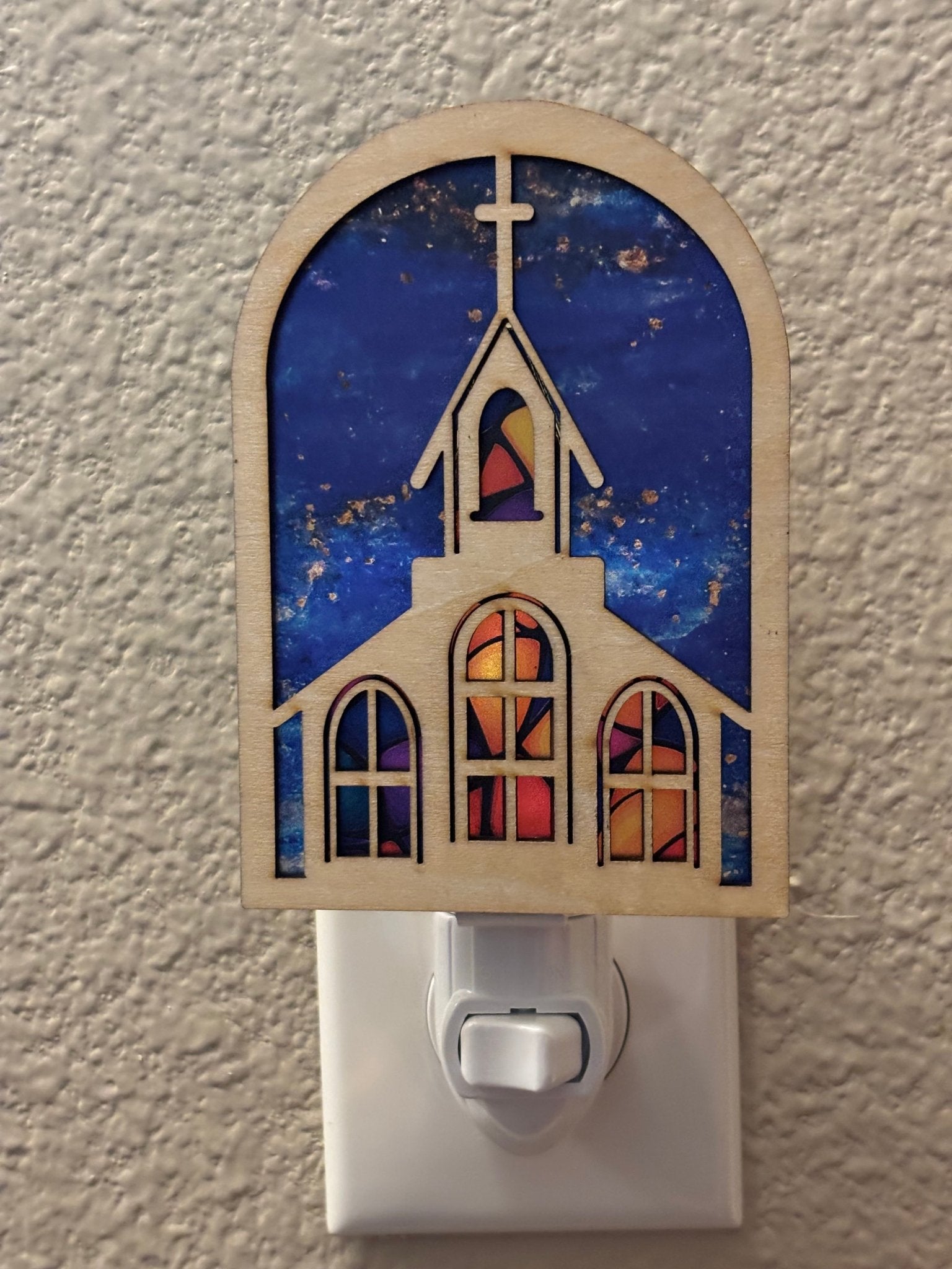 Colorful church suncatcher with stained glass effect, crafted from wood and acrylic.