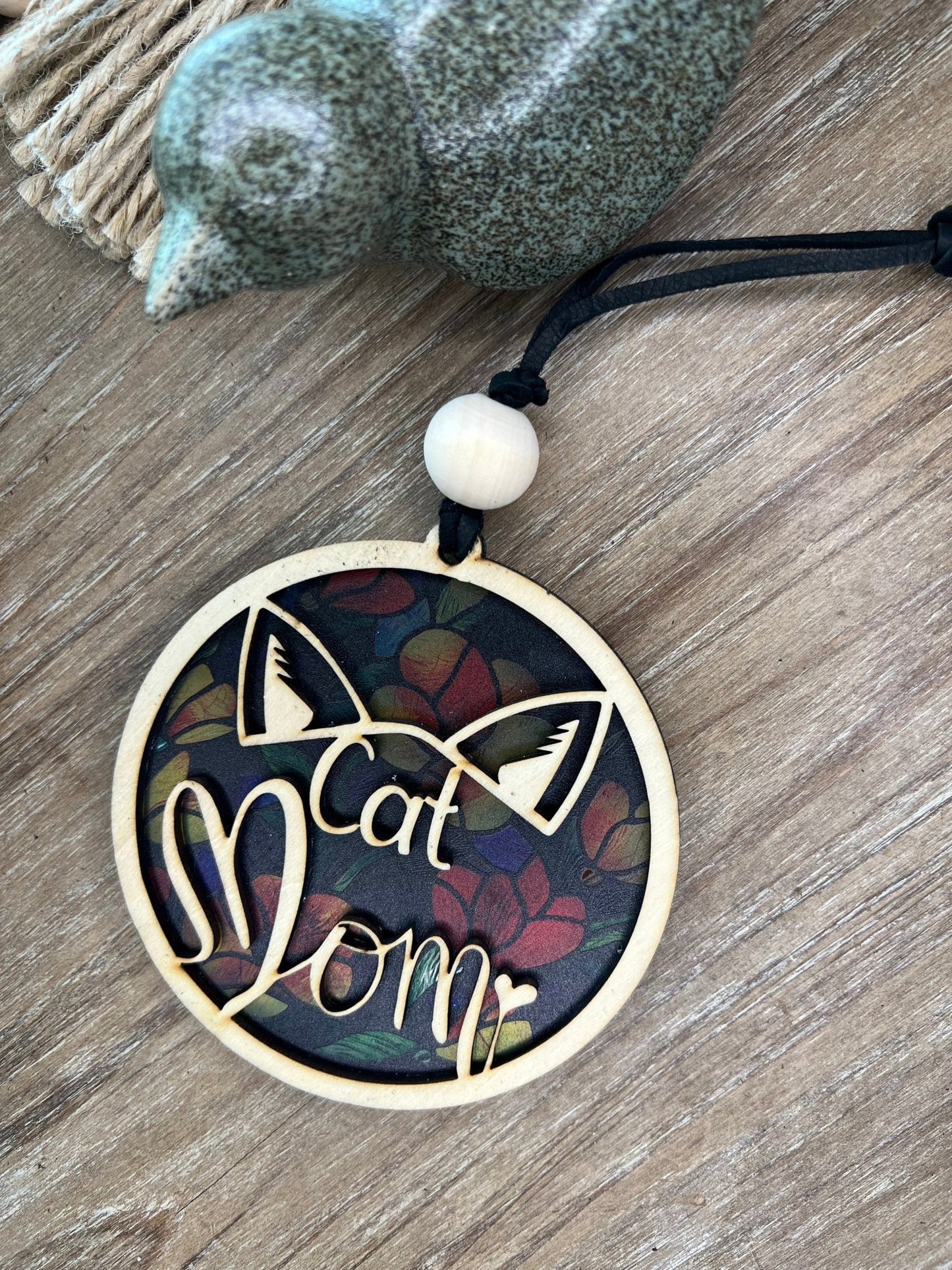 Flower Cat Mom Suncatcher featuring wood and multicolor acrylic in a stained glass effect.