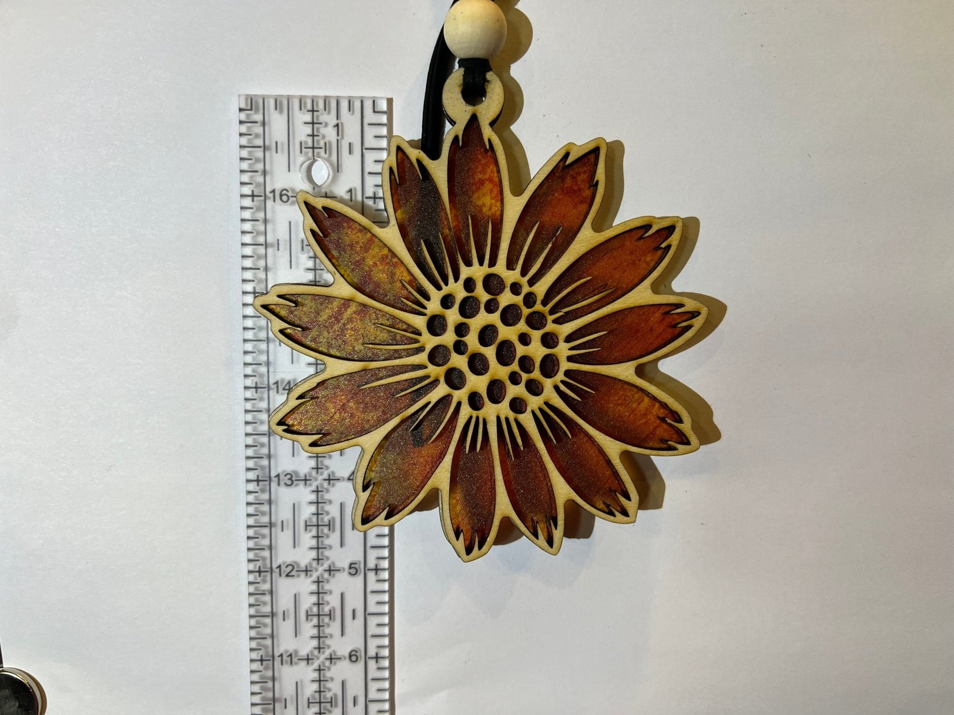 Sunflower stained glass effect suncatcher made of natural wood and acrylic.
