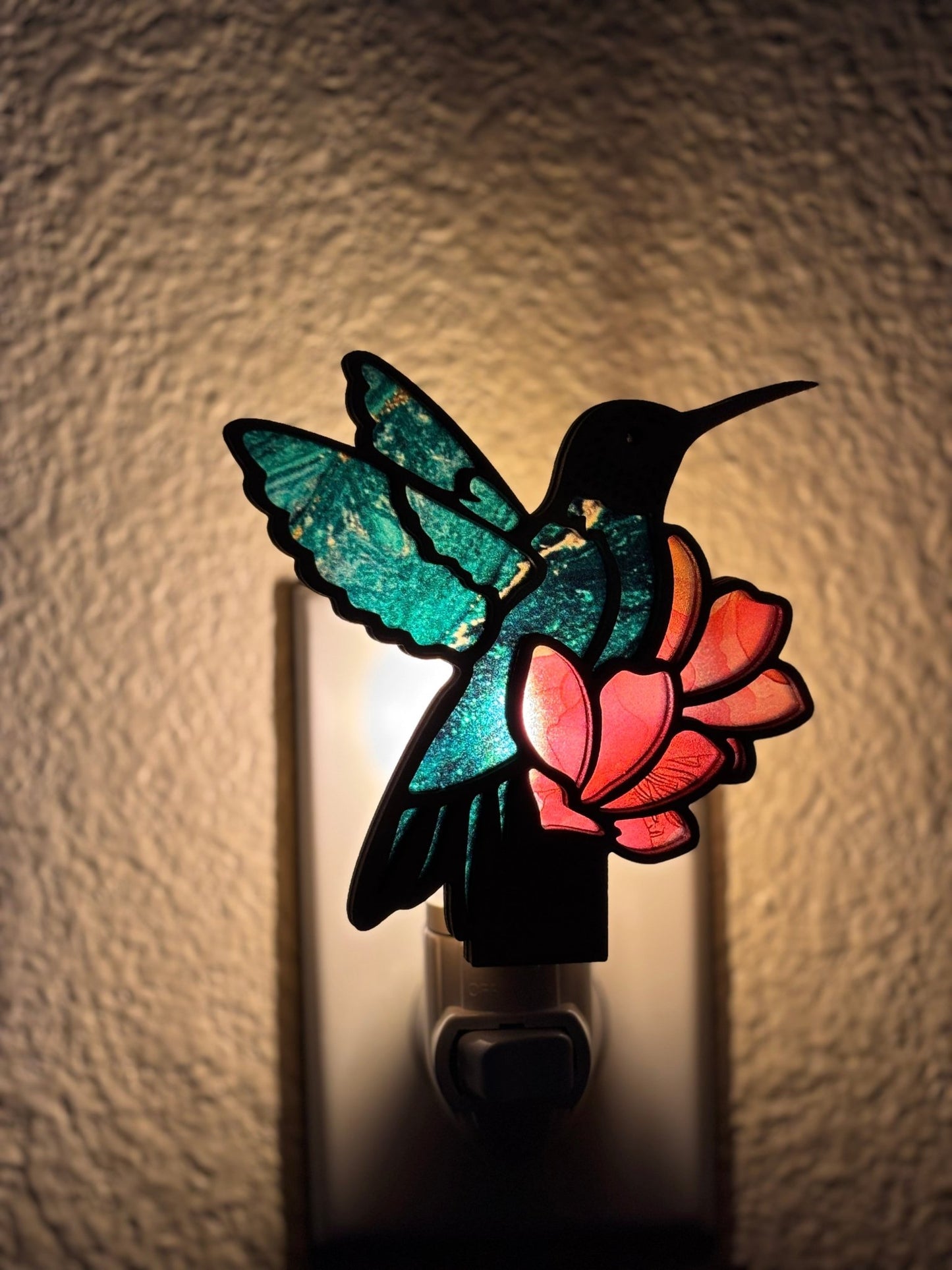 Hummingbird on Flower Nightlight in wood and acrylic with multicolor stained glass effect lighted.