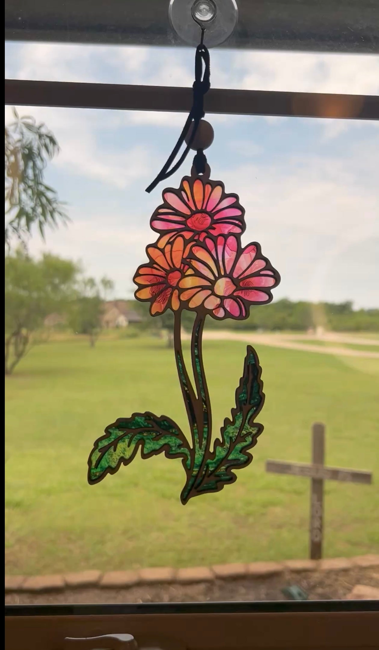Daisy Flower and Stem Suncatcher with wood and multicolor acrylic, capturing sunlight beautifully in sunlight.