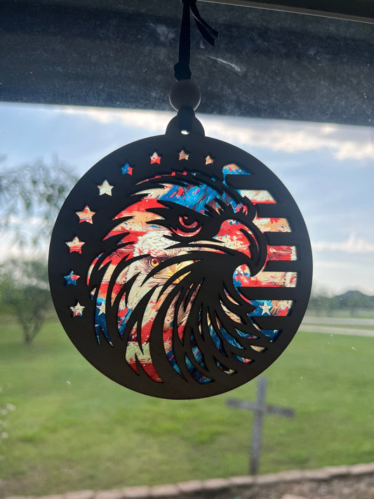 Eagle Flag Suncatcher with natural wood and multicolor acrylic, 4.75-inch in sunlight.