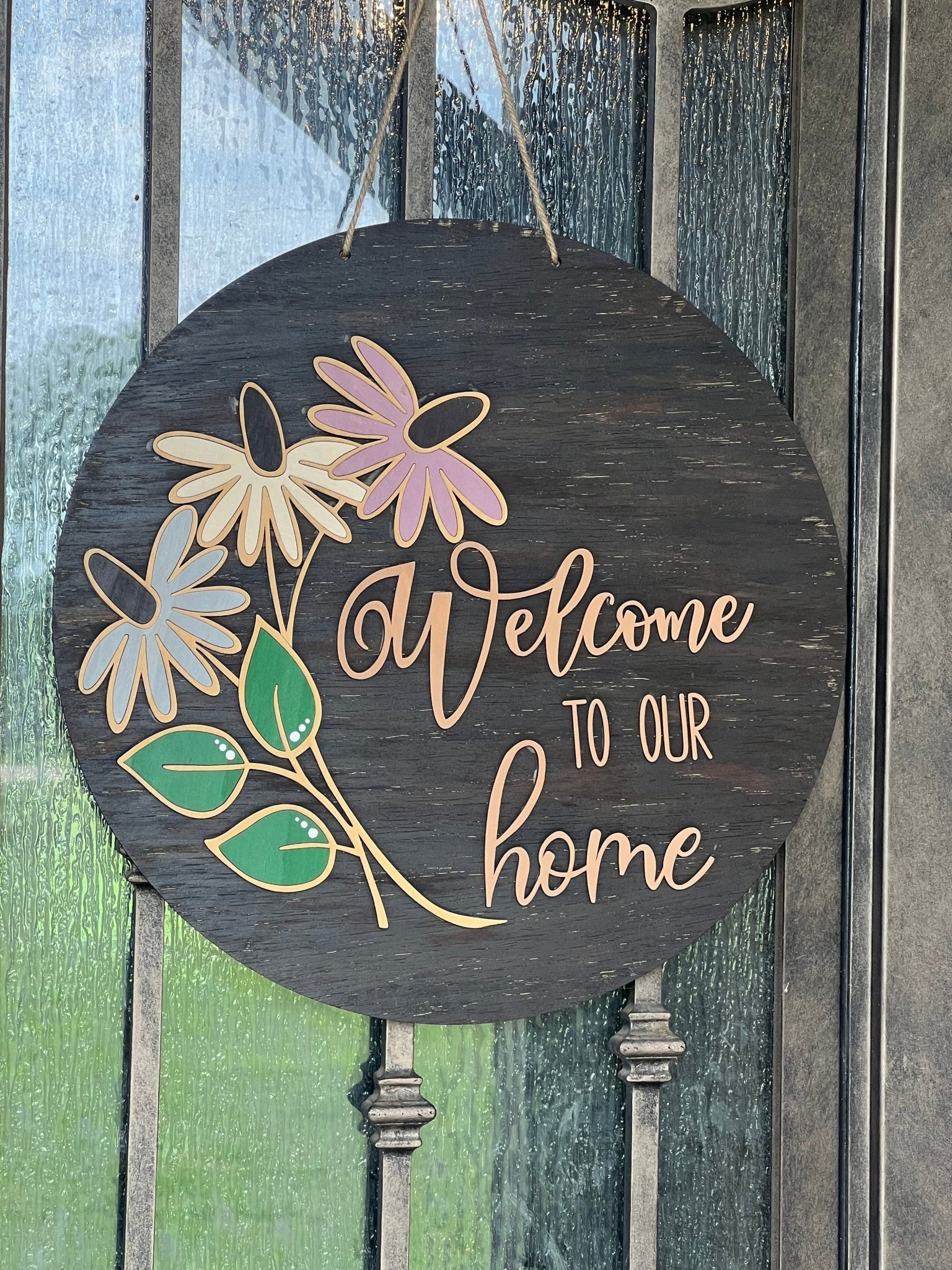 Rustic coneflower welcome door hanger made from walnut-stained wood with multicolor accents, perfect for home decor.