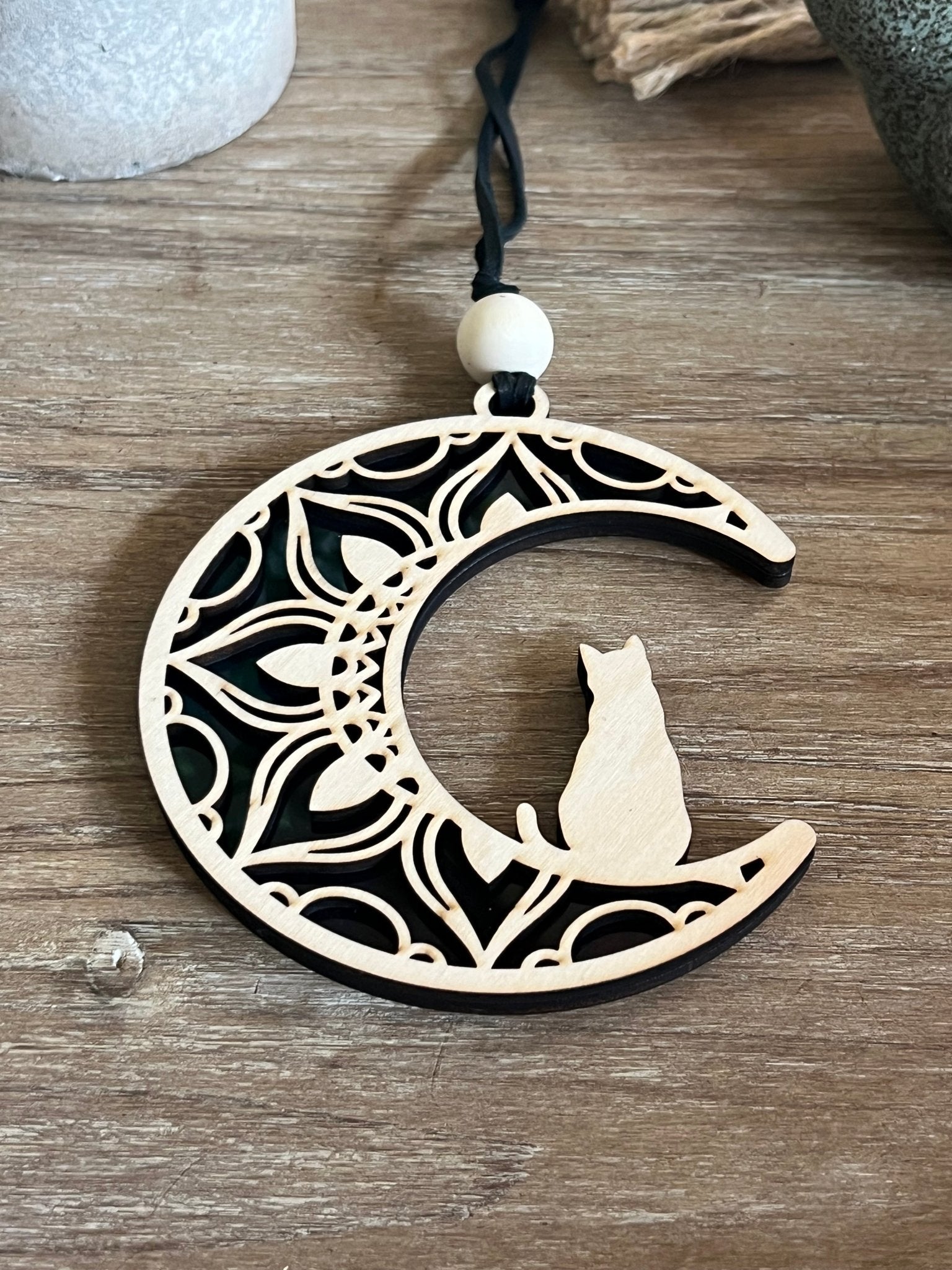 Rustic Cat on the Moon suncatcher with wood and acrylic, in natural hues.