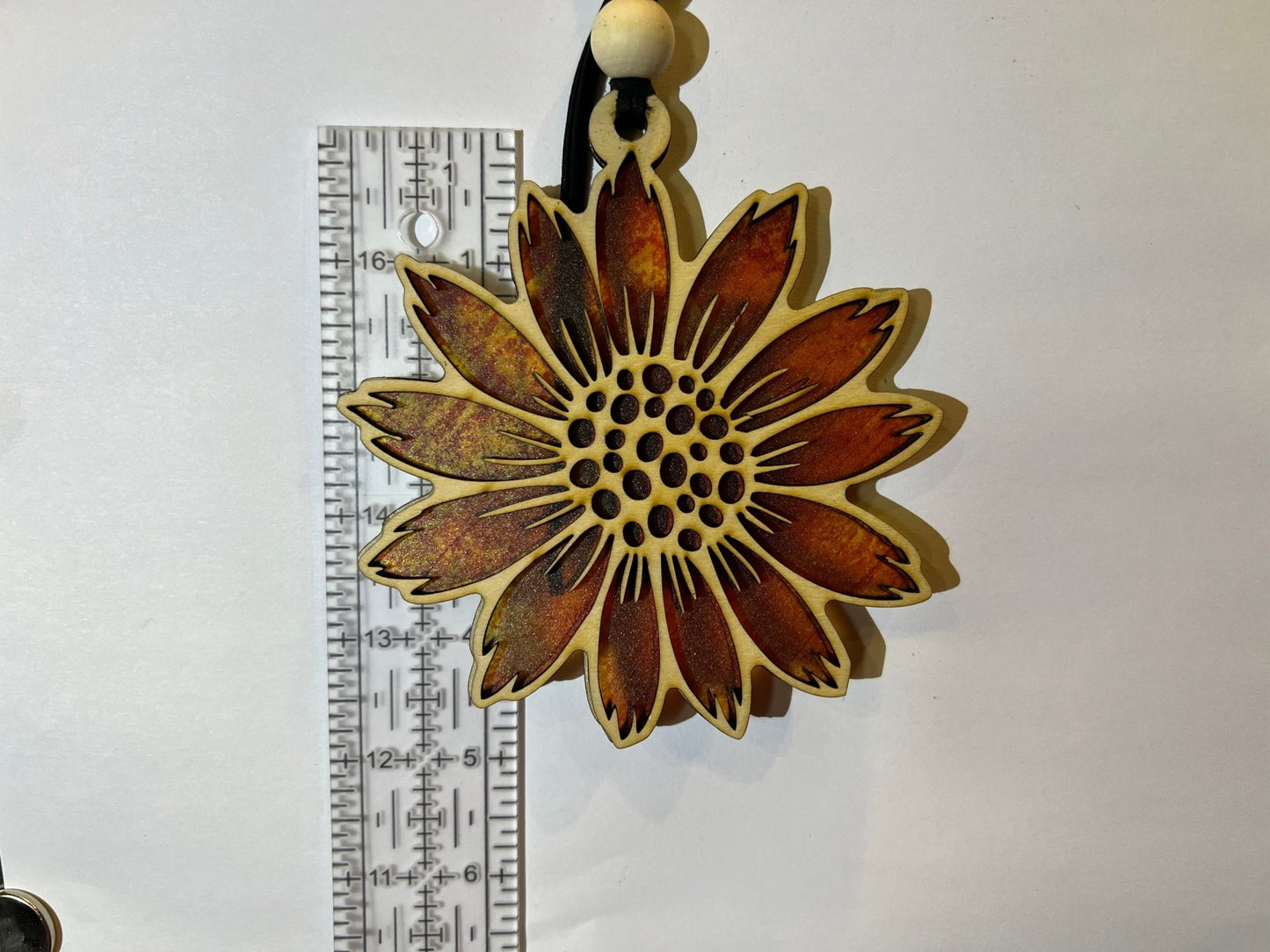 Sunflower stained glass effect suncatcher made of natural wood and acrylic.