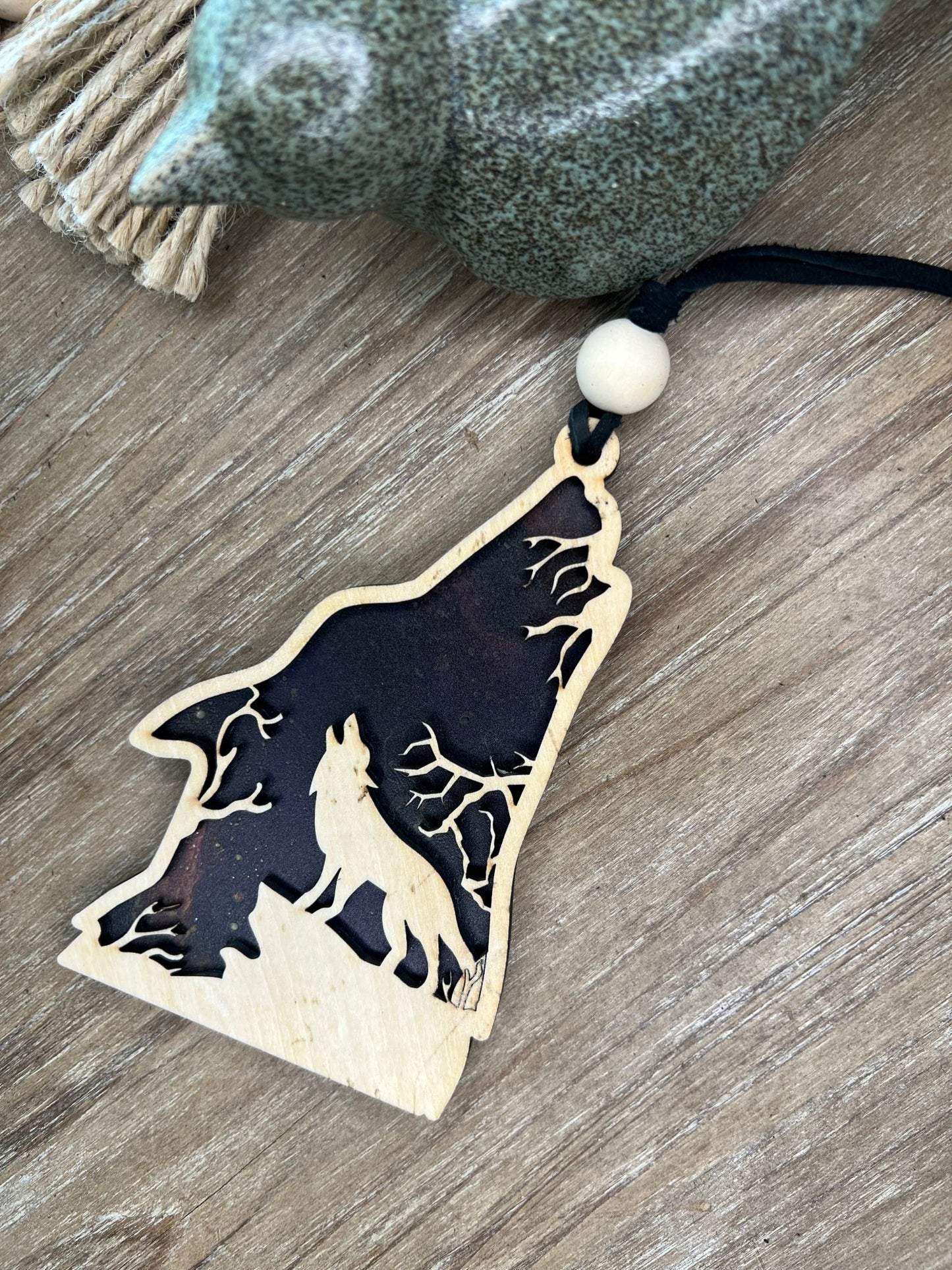 Howling Wolf Suncatcher in wood and multicolor acrylic, 4.75x3 inches.