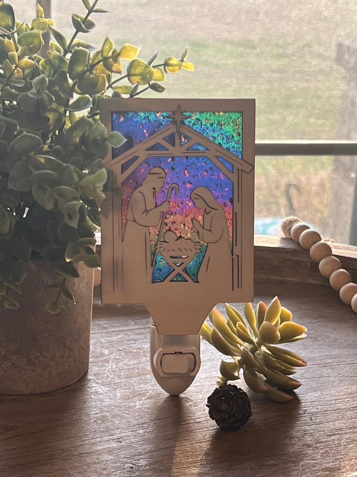 Christmas Nativity Nightlight made of wood and acrylic, featuring natural wood and multicolor elements in natural light.