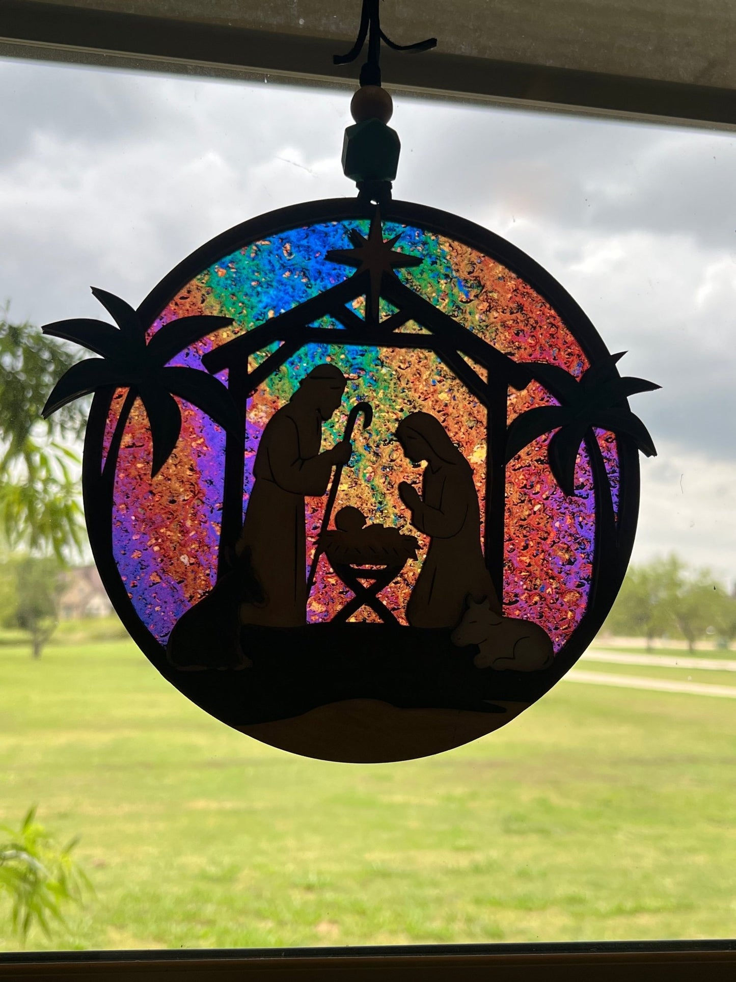 Haunted House Lantern Nightlight with stained glass effect in golden oak wood, perfect for rustic decor - on a window.