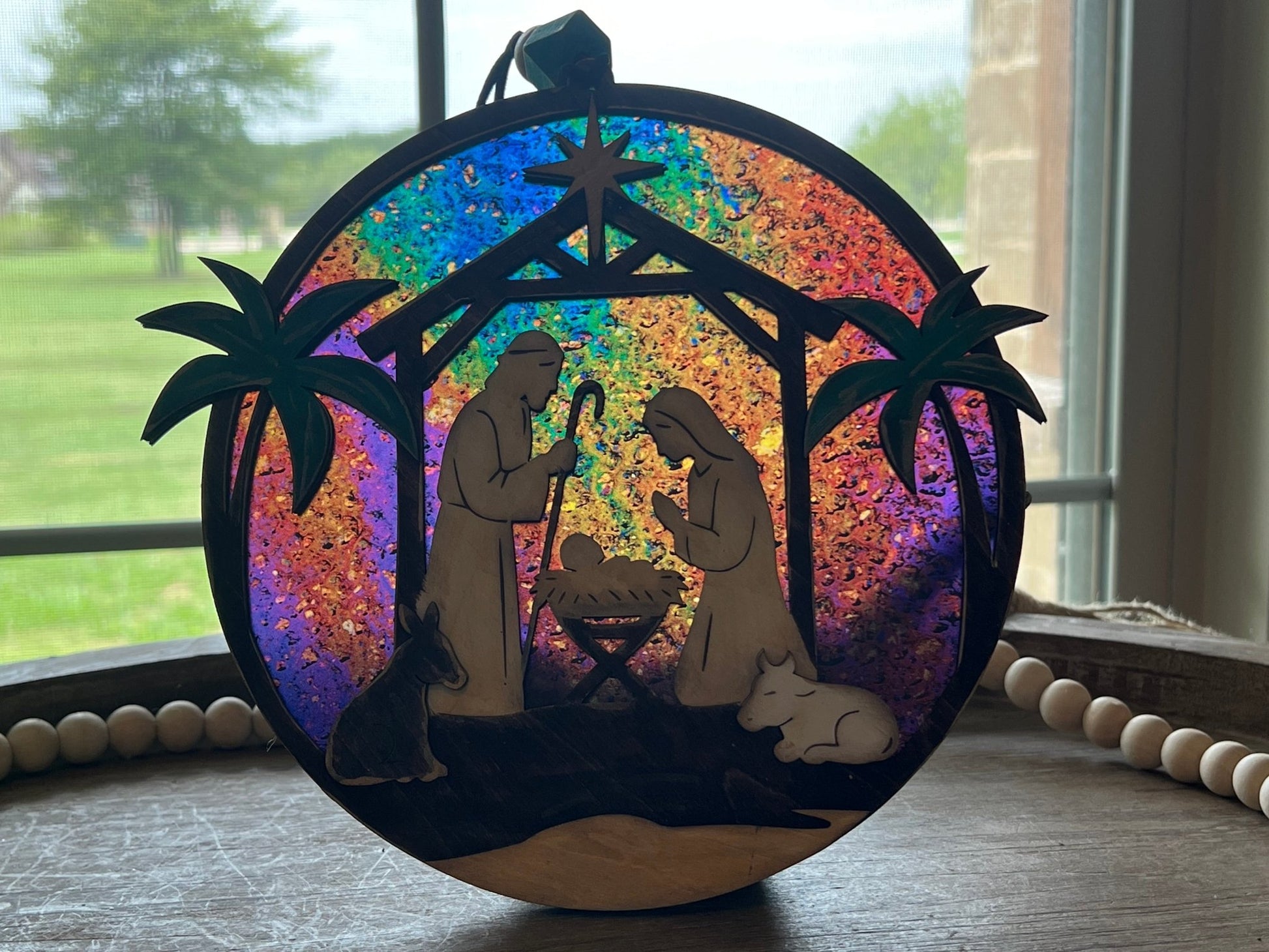 Haunted House Lantern Nightlight with stained glass effect in golden oak wood, perfect for rustic decor - in sunlight.