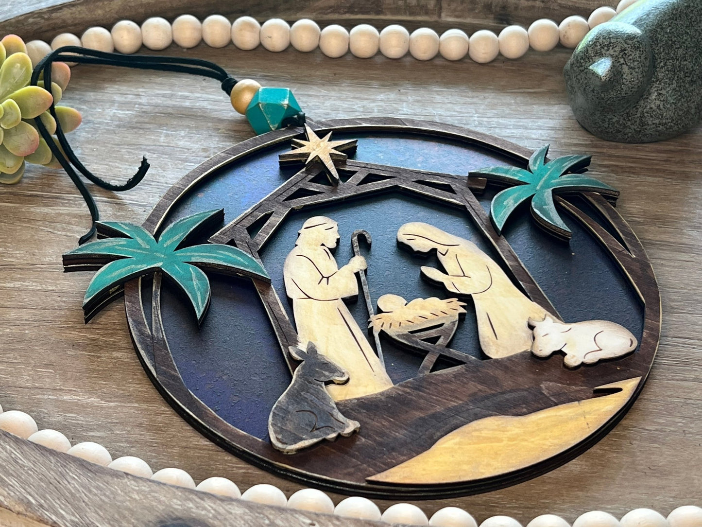 Haunted House Lantern Nightlight with stained glass effect in golden oak wood, perfect for rustic decor - lying on a tray.