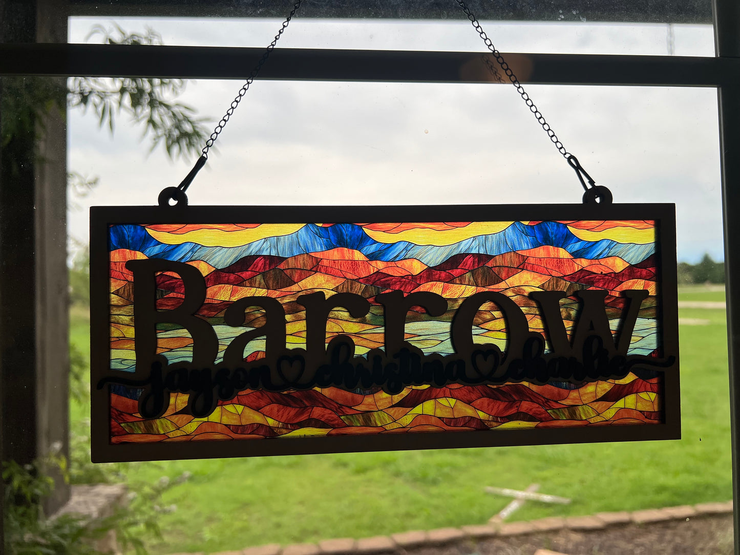 Family Personalized Suncatcher in natural wood and multicolor acrylic, showcasing rustic-modern style. In sublight