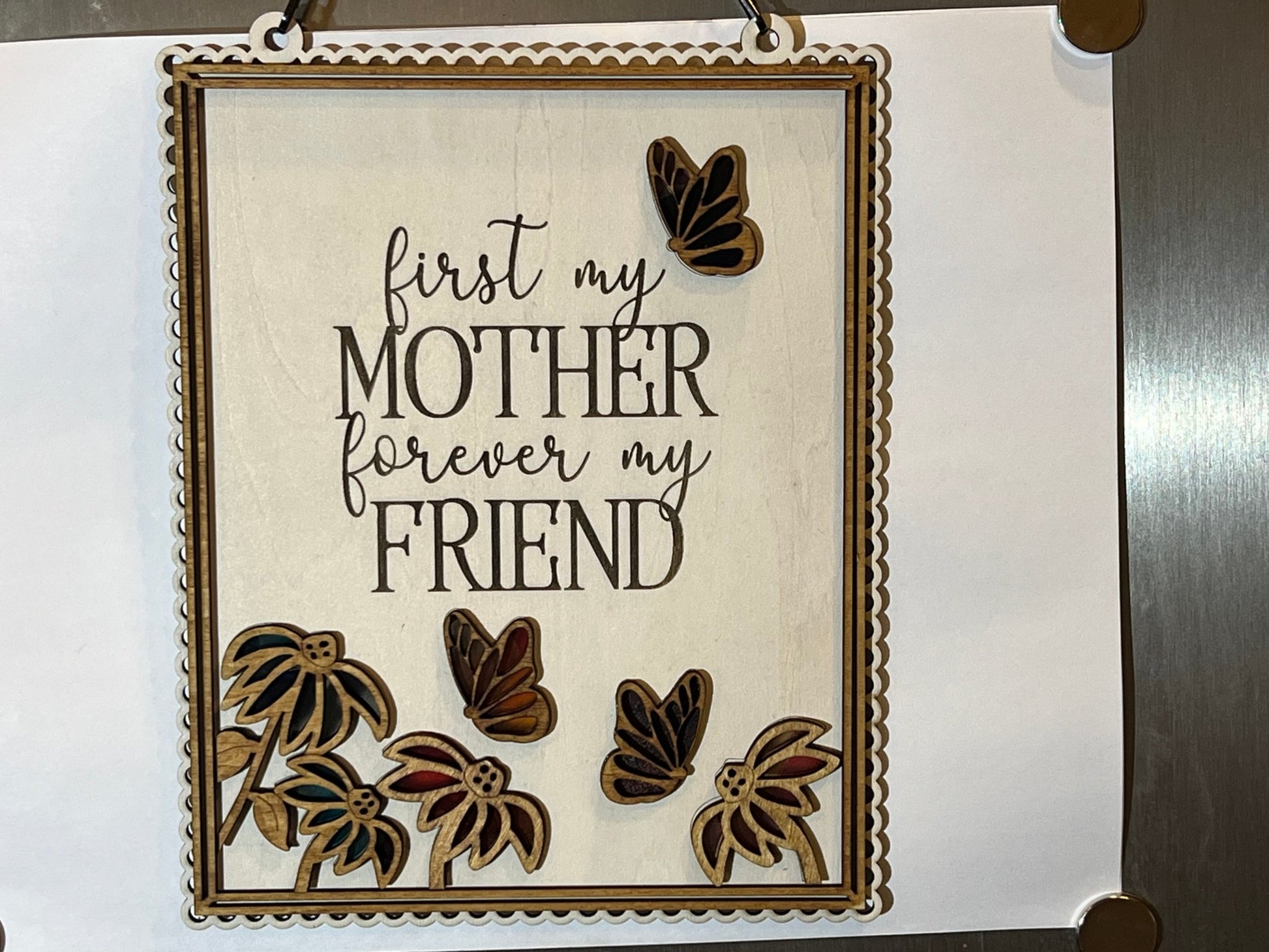 Colorful Mother Butterfly Suncatcher made of acrylic and wood, on a white background.