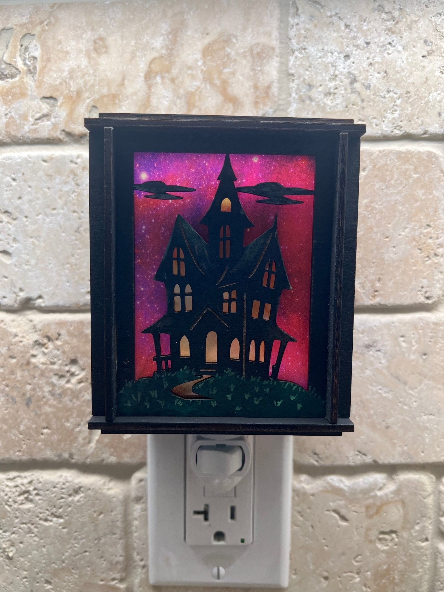 A haunted house hand painted stained glass effect nightlight, multicolor acrylic and black wood design - tile background.