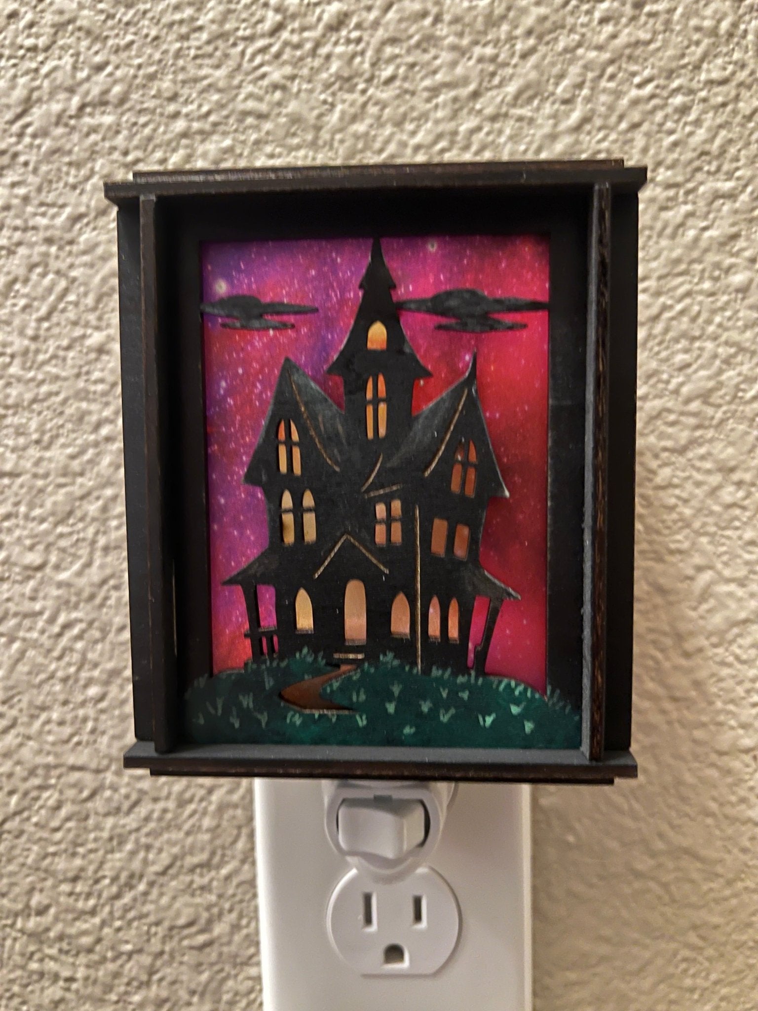 A haunted house hand painted stained glass effect nightlight, multicolor acrylic and black wood design - Front view.