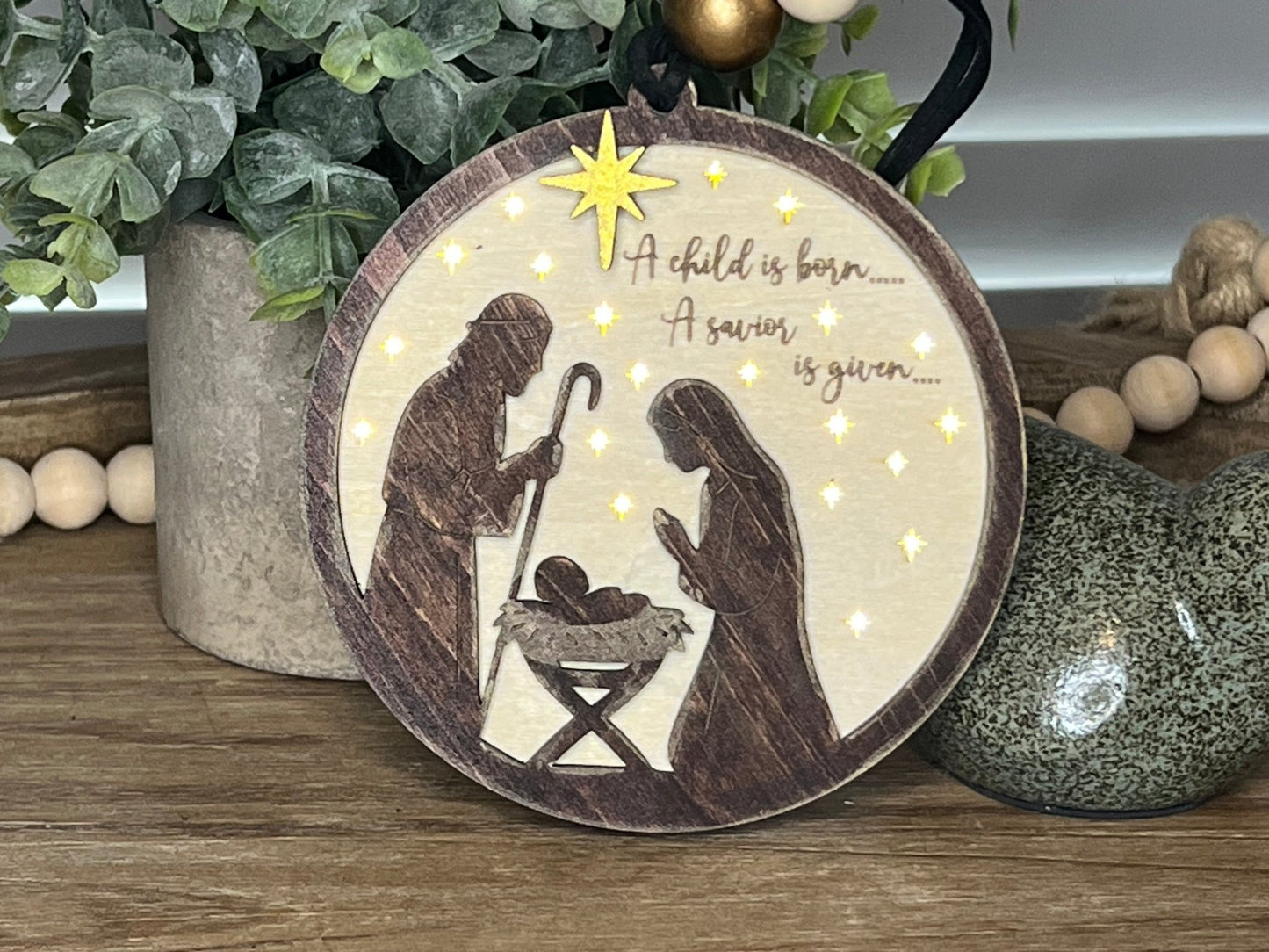Lighted Christmas Nativity Ornament in natural wood with walnut stain front view.