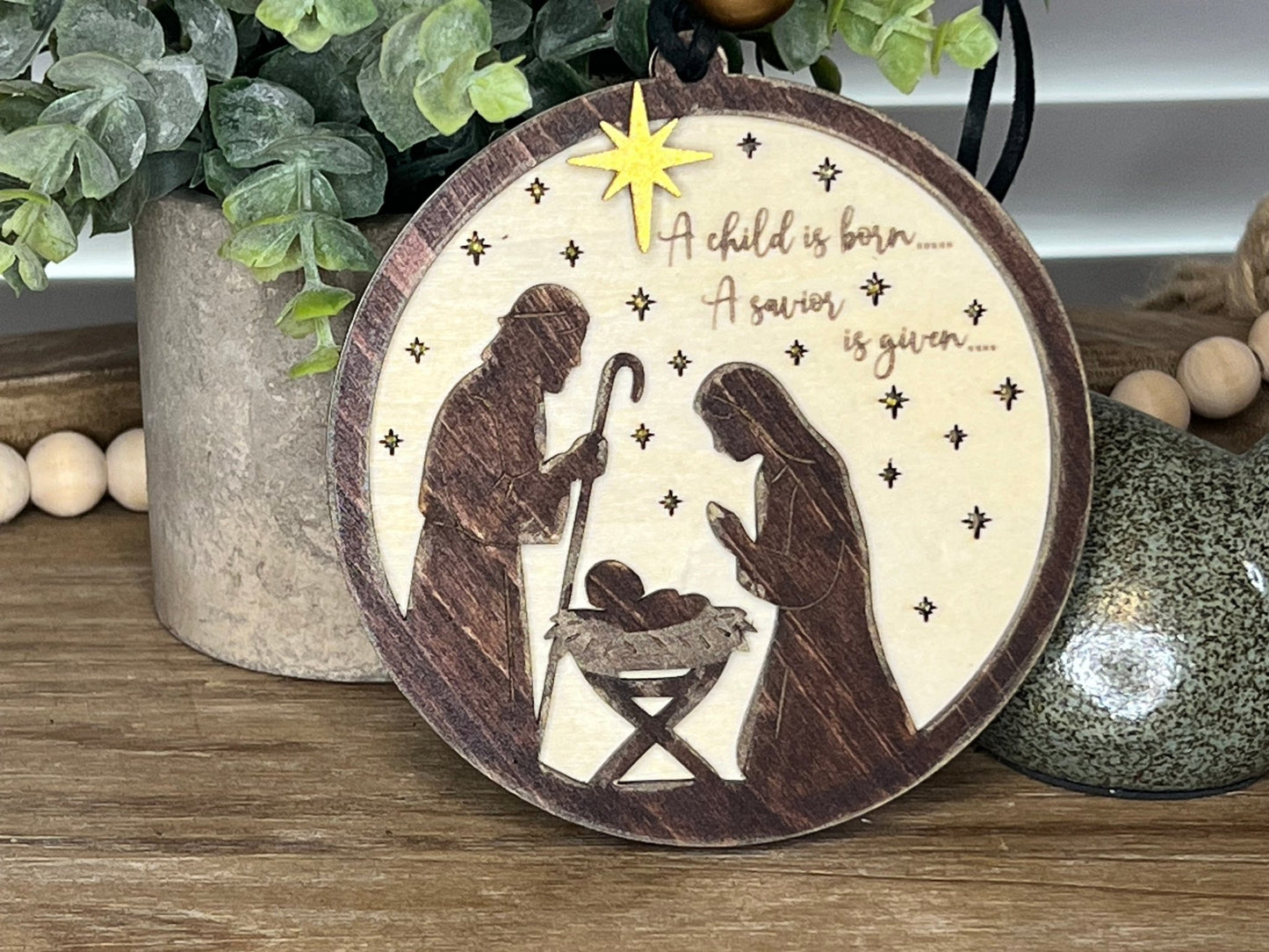 Lighted Christmas Nativity Ornament in natural wood with walnut stain unlit front facing.