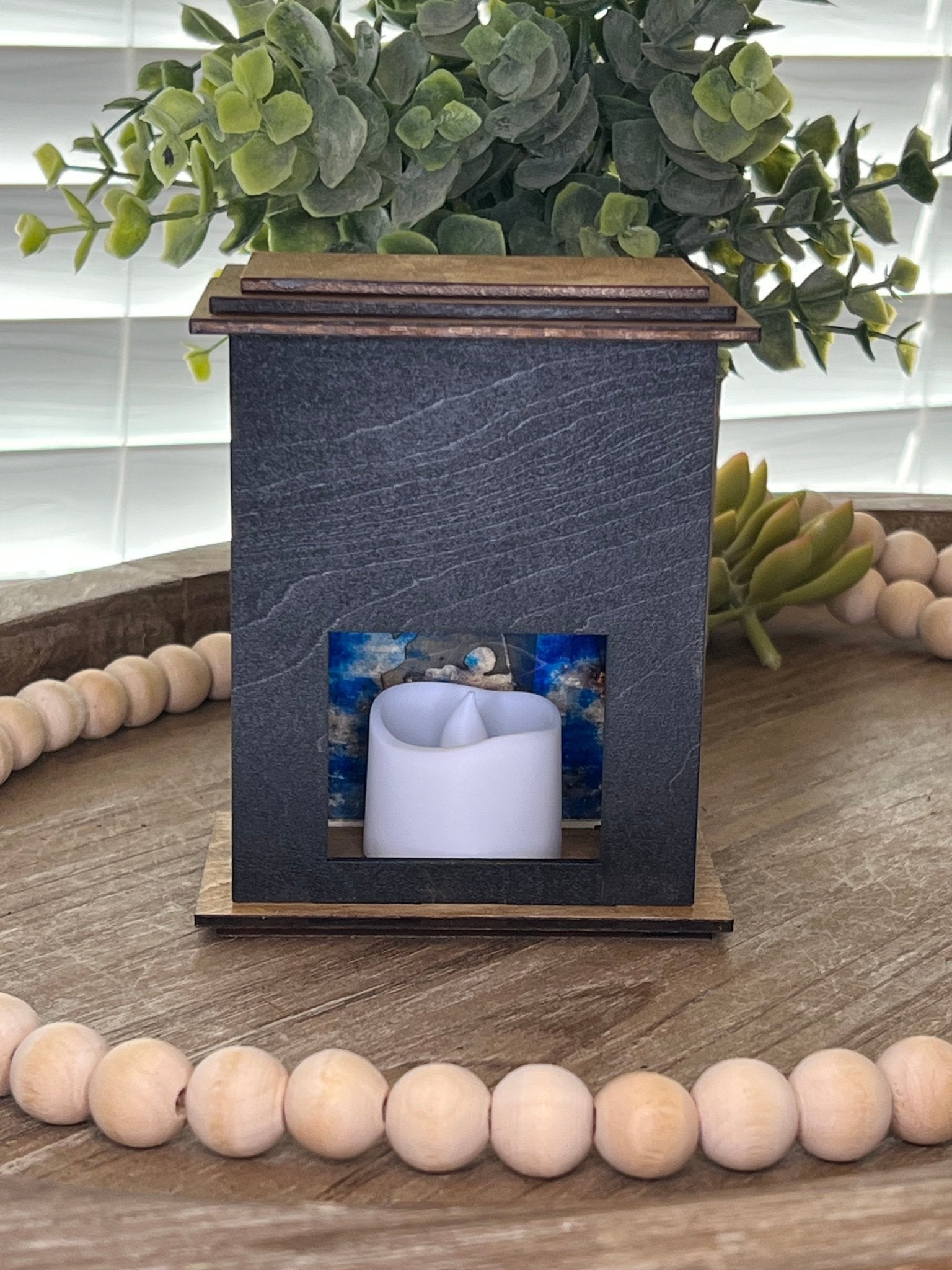 Rustic black and golden oak nativity lantern with LED tea-light candle, perfect for holiday decor, back, unlit view