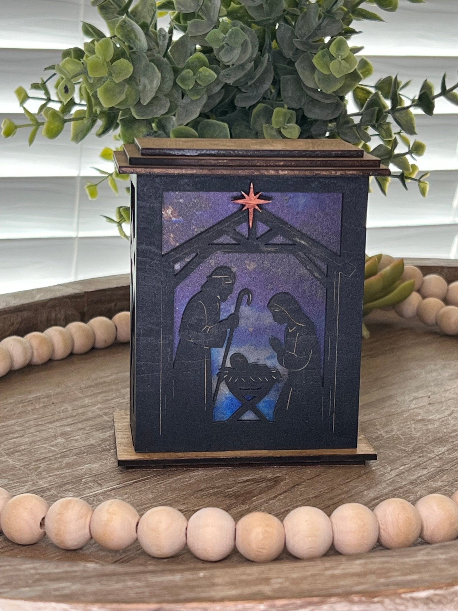 Rustic black and golden oak nativity lantern with LED tea-light candle, perfect for holiday decor, front,un lit view