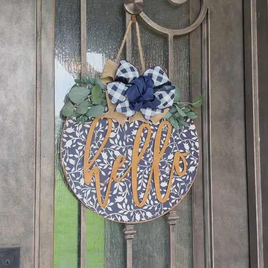 Navy wood hello door hanger with mini flowers on metal door video, perfect for rustic entryway decor.