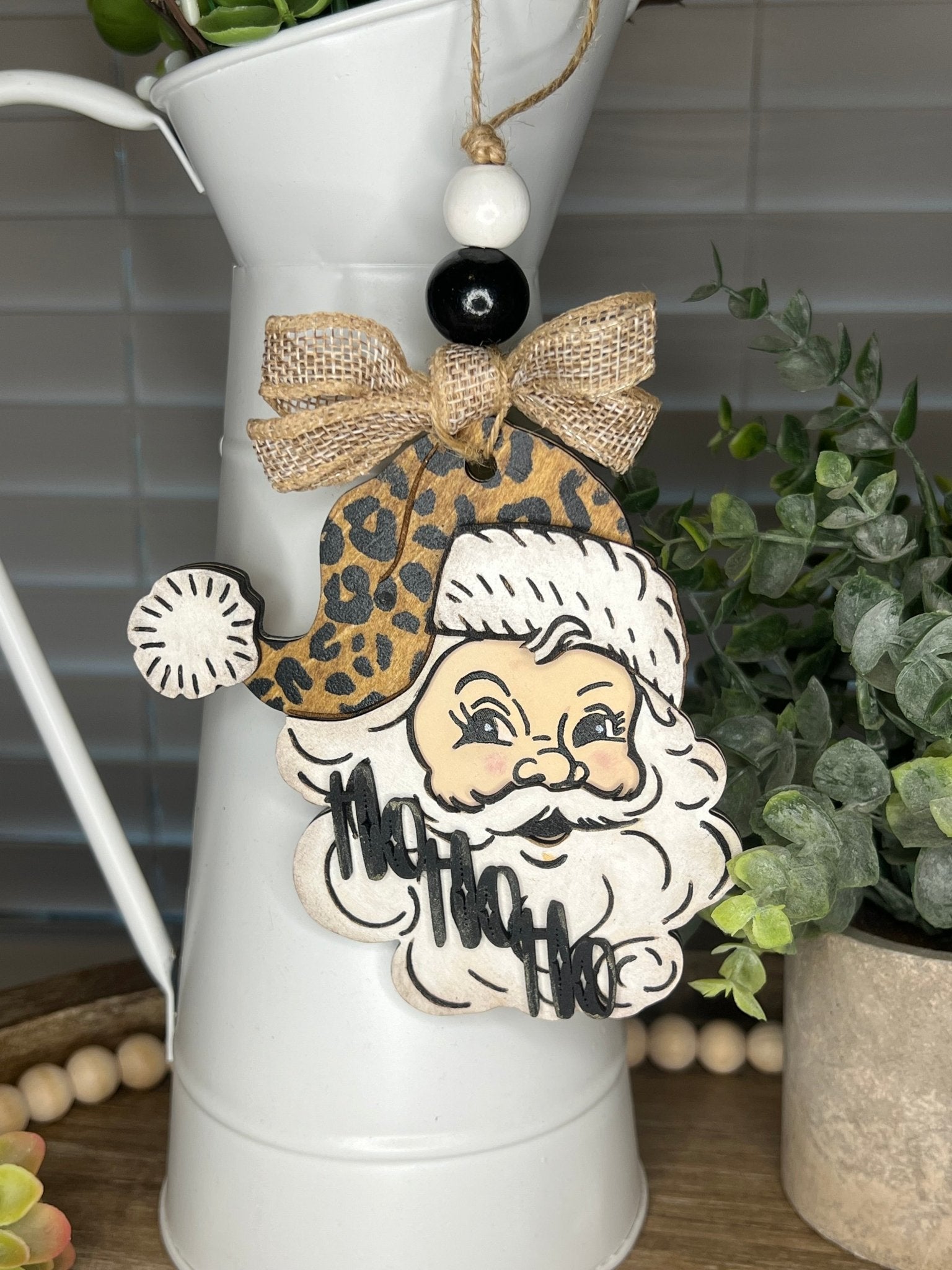 Vintage Santa Christmas Ornament with a leopard hat, made of natural wood - hanging.