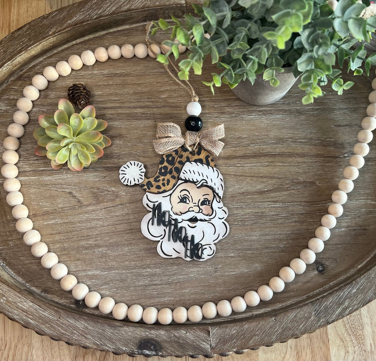 Vintage Santa Christmas Ornament with a leopard hat, made of natural wood -zoomed out.